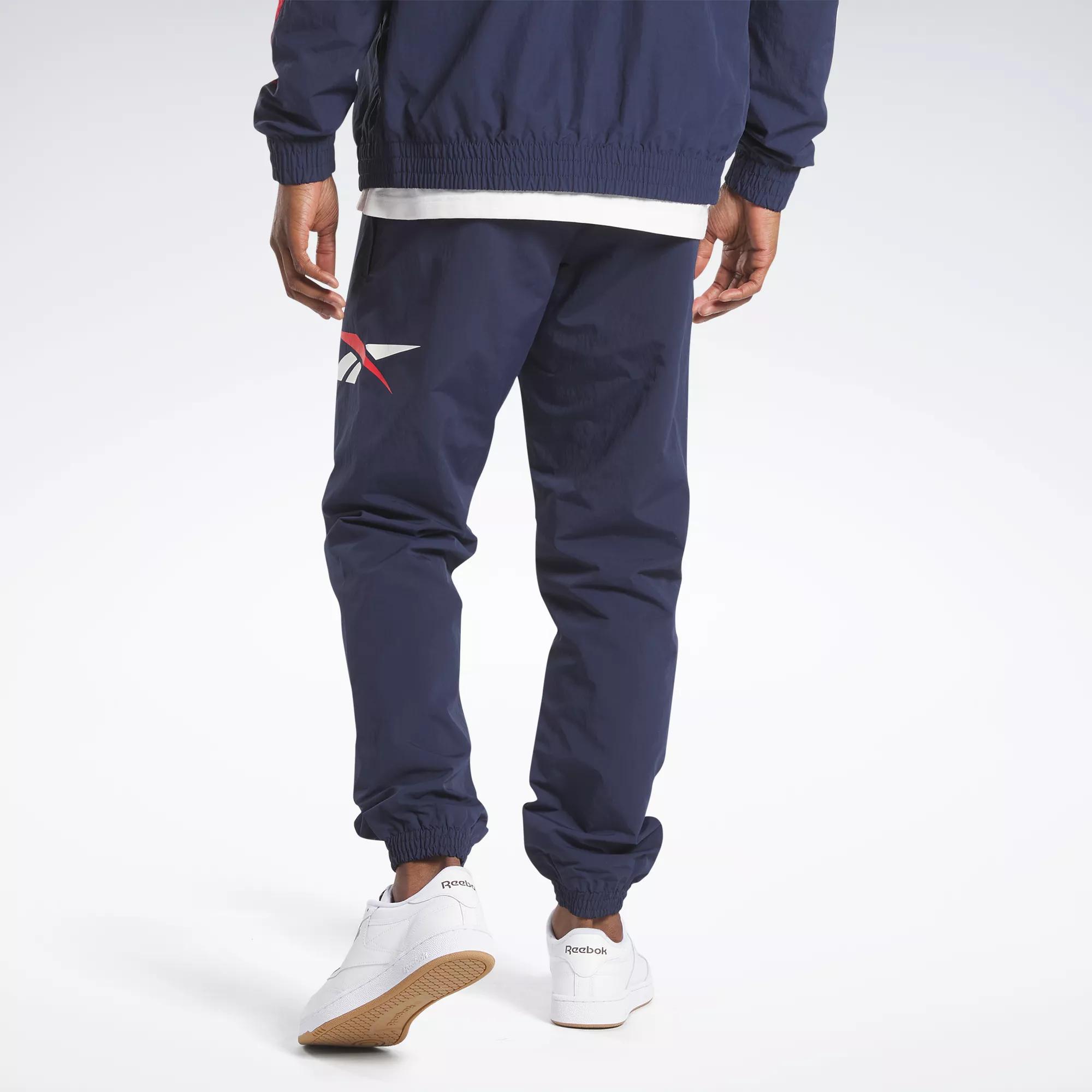 Reebok Men's Training Essentials Woven Cuffed Track Pants, Vector Navy, S :  : Fashion