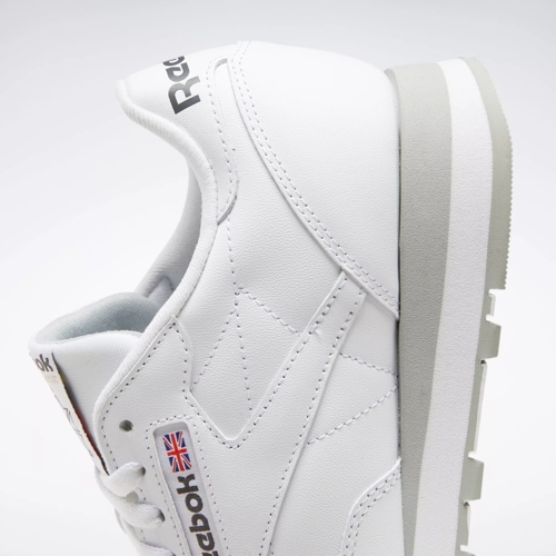 white and grey reebok