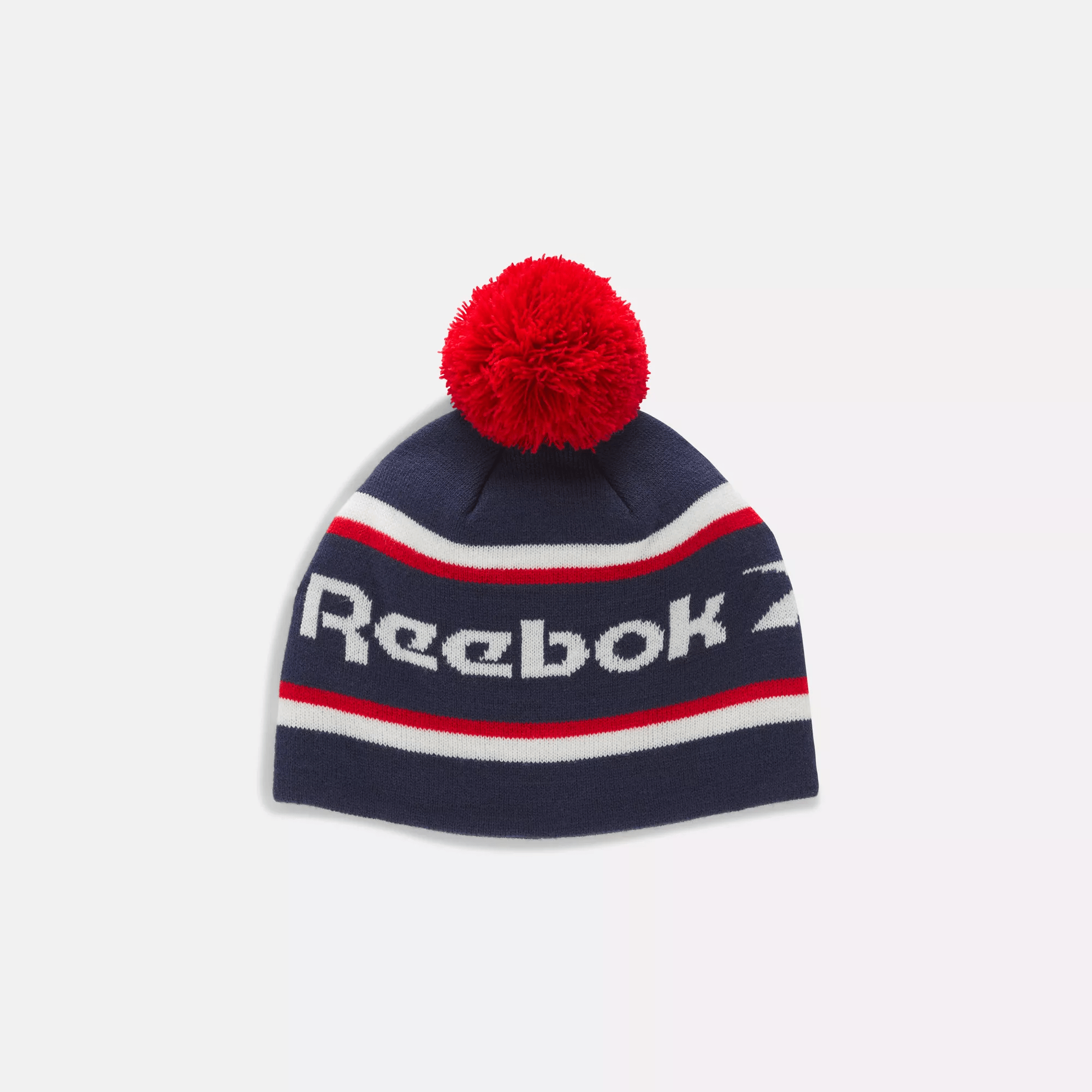 Shop Reebok Unisex  Classic Beanie With Pompom In In Vector Navy/ Vector Red/ Chalk