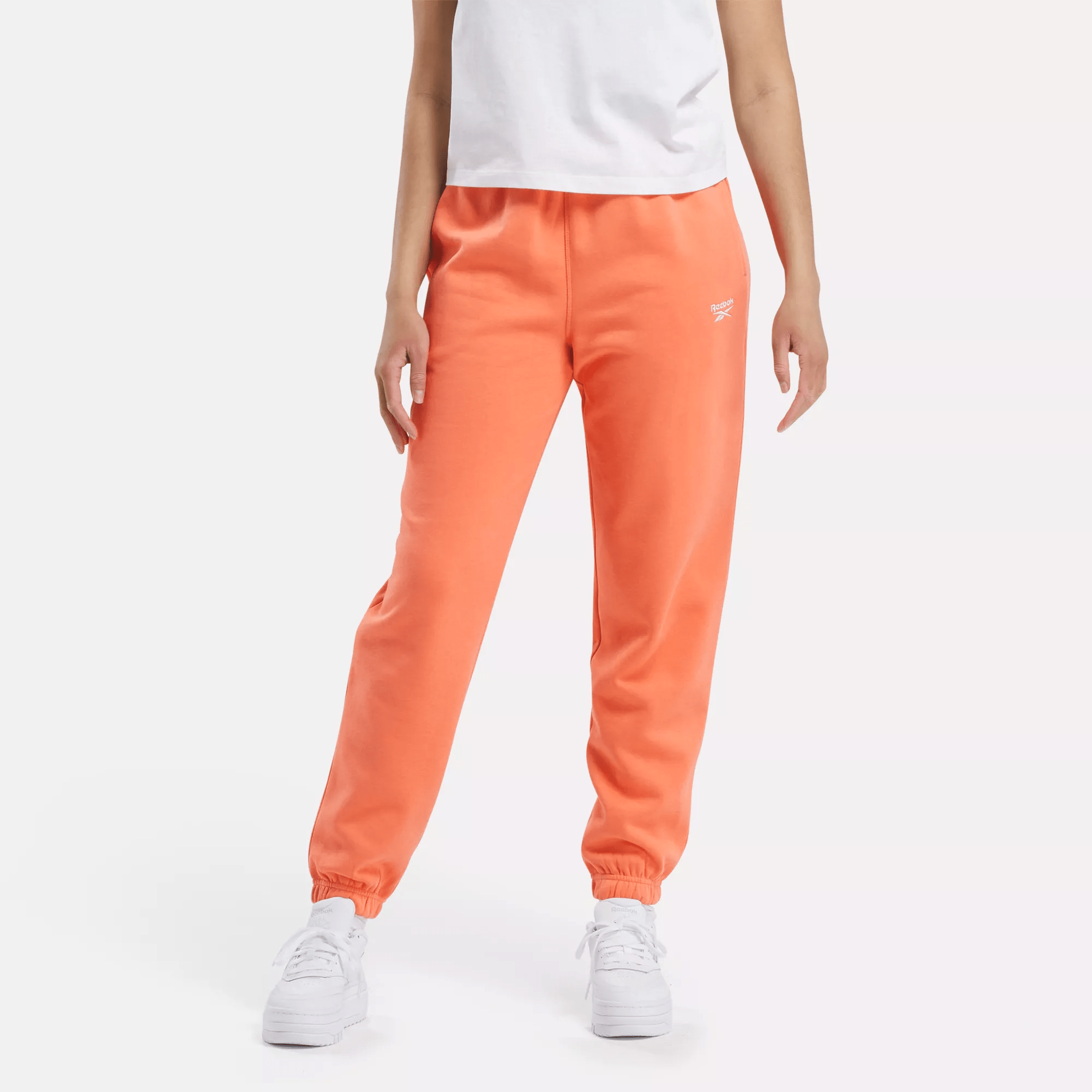 Shop Reebok Women's  Identity Small Logo Fleece Joggers In Supercharged Coral